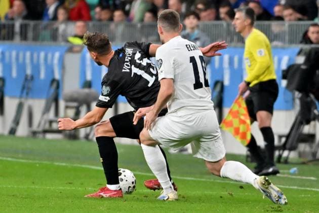 Ljubljana, Slovenia, November 15th 2025, Mergim Vojvoda of Kosovo (L) in action against Timi Max Elsnik of Slovenia (R) during the UEFA European Qualifiers for 2026 World Cup, Group B match between Slovenia and Kosovo at Stadium Stozice, Ljubljana, Slovenia. (Photo by Igor Kupljenik Sports Press Photo) Copyright: xIgorxKupljenikx xSPPx Sportspressphoto_SPR62158