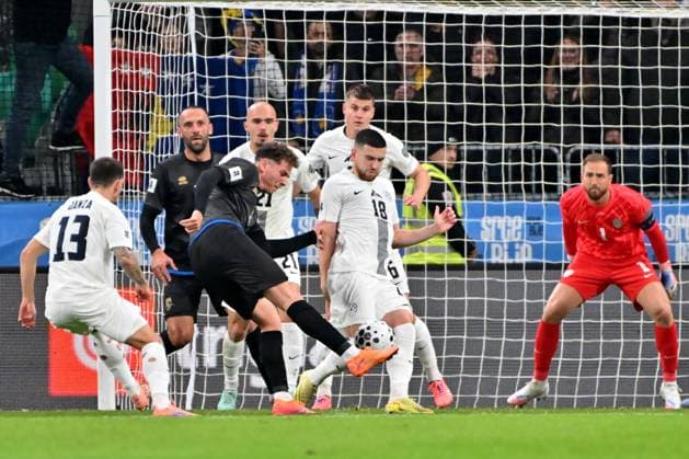 Ljubljana, Slovenia, November 15th 2025, Fisnik Asllani of Kosovo (C) in action against Jan Oblak of Slovenia (R) during the UEFA European Qualifiers for 2026 World Cup, Group B match between Slovenia and Kosovo at Stadium Stozice, Ljubljana, Slovenia. (Photo by Igor Kupljenik Sports Press Photo) Copyright: xIgorxKupljenikx xSPPx Sportspressphoto_SPR62163