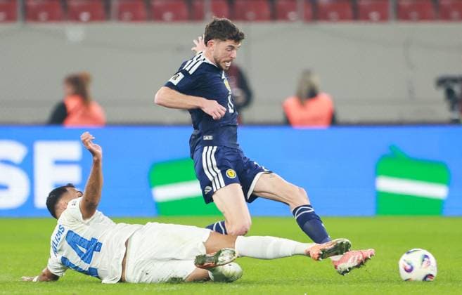 Vangelis Pavlidis of Greece tackles Connor Barron of Scotland Greece v Scotland, FIFA 2026 World Cup Qualifying, Group C, Football, Georgios Karaiskakis Stadium, Athens, Greece - 15 Nov 2025Athens Georgios Karaiskakis Stadium Greece EDITORIAL USE ONLY No use with unauthorised audio, video, data, fixture lists, club league logos or live services. Online in-match use limited to 120 images, no video emulation. No use in betting, games or single club league player publications. Copyright: xNikolaxKrstic Shutterstockx 15786160cg