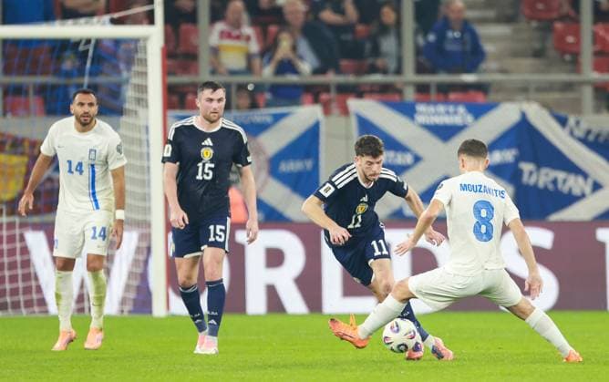 Connor Barron of Scotland takes on Fotis Ioannidis of Greece Greece v Scotland, FIFA 2026 World Cup Qualifying, Group C, Football, Georgios Karaiskakis Stadium, Athens, Greece - 15 Nov 2025Athens Georgios Karaiskakis Stadium Greece EDITORIAL USE ONLY No use with unauthorised audio, video, data, fixture lists, club league logos or live services. Online in-match use limited to 120 images, no video emulation. No use in betting, games or single club league player publications. Copyright: xNikolaxKrstic Shutterstockx 15786160cy