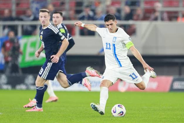 Tasos Bakasetas of Greece as Josh Mulligan of Scotland looks on Greece v Scotland, FIFA 2026 World Cup Qualifying, Group C, Football, Georgios Karaiskakis Stadium, Athens, Greece - 15 Nov 2025Athens Georgios Karaiskakis Stadium Greece EDITORIAL USE ONLY No use with unauthorised audio, video, data, fixture lists, club league logos or live services. Online in-match use limited to 120 images, no video emulation. No use in betting, games or single club league player publications. Copyright: xNikolaxKrstic Shutterstockx 15786160db