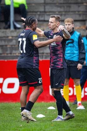 15 11 2025, xovx, Soccer Lotto Hessenliga, FC Gießen FC Eddersheim v l Melvin Curtis Njontie FC Gießen and Mirco Geisler FC Gießen cheer after scoring the goal to make it 2 0 Gießen Waldstadion Hessen Germany EN