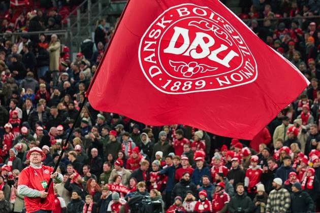 Flagbearer holds big DBU flag prior to kick-off for the UEFA¯World¯Cup Qualifier match between Denmark and Belarus at Parken on November 15, 2025 in Copenhagen, Denmark (Photo by Camilla Stolen Imago) Copenhagen Denmark Copyright: xCamillaxStolenx L1092448