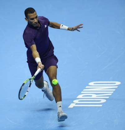 (251116) -- TURIN, Nov. 16, 2025 -- Felix Auger-Aliassime returns a shot during the men s singles semifinal match between Carlos Alcaraz of Spain and Felix Auger-Aliassime of Canada at the ATP, Tennis Herren Finals tennis tournament in Turin, Italy, on Nov. 15, 2025. ) (SP) ITALY-TURIN-ATP FINALS-MEN S SINGLES-SEMIFINAL LixJing 