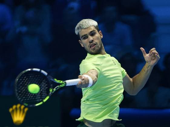 (251116) -- TURIN, Nov. 16, 2025 -- Carlos Alcaraz returns a shot during the men s singles semifinal match between Carlos Alcaraz of Spain and Felix Auger-Aliassime of Canada at the ATP, Tennis Herren Finals tennis tournament in Turin, Italy, on Nov. 15, 2025. ) (SP) ITALY-TURIN-ATP FINALS-MEN S SINGLES-SEMIFINAL LixJing 