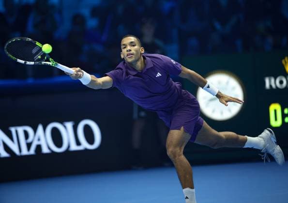 (251116) -- TURIN, Nov. 16, 2025 -- Felix Auger-Aliassime returns a shot during the men s singles semifinal match between Carlos Alcaraz of Spain and Felix Auger-Aliassime of Canada at the ATP, Tennis Herren Finals tennis tournament in Turin, Italy, on Nov. 15, 2025. ) (SP) ITALY-TURIN-ATP FINALS-MEN S SINGLES-SEMIFINAL LixJing 