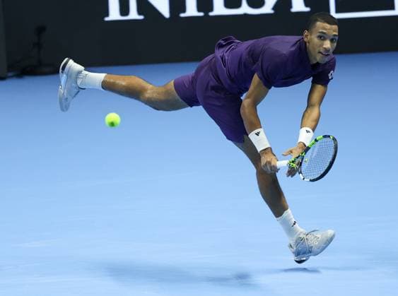 (251116) -- TURIN, Nov. 16, 2025 -- Felix Auger-Aliassime returns a shot during the men s singles semifinal match between Carlos Alcaraz of Spain and Felix Auger-Aliassime of Canada at the ATP, Tennis Herren Finals tennis tournament in Turin, Italy, on Nov. 15, 2025. ) (SP) ITALY-TURIN-ATP FINALS-MEN S SINGLES-SEMIFINAL LixJing 