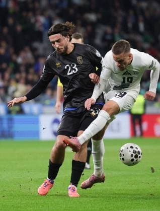 (251116) -- LJUBLJANA, Nov. 16, 2025 -- Tomi Horvat (R) of Slovenia vies with Leon Avdullahu of Kosovo during the FIFA World Cup, WM, Weltmeisterschaft, Fussball 2026 European qualifiers between Slovenia and Kosovo in Ljubljana, Slovenia, Nov. 15, 2025. (Photo by Xinhua) (SP) SLOVENIA-LJUBLJANA-FIFA WORLD CUP 2026 EUROPEAN QUALIFIERS-SLOVENIA VS KOSOVO ZeljkoxStevanic 
