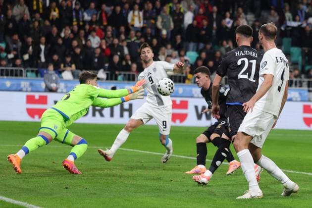 (251116) -- LJUBLJANA, Nov. 16, 2025 -- Goalkeeper Amir Saipi (1st L) of Kosovo saves during the FIFA World Cup, WM, Weltmeisterschaft, Fussball 2026 European qualifiers between Slovenia and Kosovo in Ljubljana, Slovenia, Nov. 15, 2025. (Photo by Xinhua) (SP) SLOVENIA-LJUBLJANA-FIFA WORLD CUP 2026 EUROPEAN QUALIFIERS-SLOVENIA VS KOSOVO ZeljkoxStevanic 