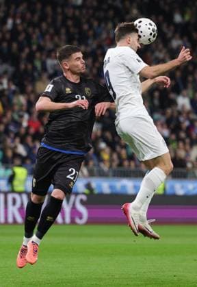 (251116) -- LJUBLJANA, Nov. 16, 2025 -- Andraz Sporar (C) of Slovenia vies for a header with Albian Hajdari (L) of Kosovo during the FIFA World Cup, WM, Weltmeisterschaft, Fussball 2026 European qualifiers between Slovenia and Kosovo in Ljubljana, Slovenia, Nov. 15, 2025. (Photo by Xinhua) (SP) SLOVENIA-LJUBLJANA-FIFA WORLD CUP 2026 EUROPEAN QUALIFIERS-SLOVENIA VS KOSOVO ZeljkoxStevanic 