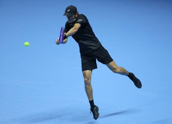 (251116) -- TURIN, Nov. 16, 2025 -- Alex De Minaur returns a shot during the men s singles semifinal match between Jannik Sinner of Italy and Alex De Minaur of Australia at the ATP, Tennis Herren Finals tennis tournament in Turin, Italy, on Nov. 15, 2025. ) (SP) ITALY-TURIN-ATP FINALS-MEN S SINGLES-SEMIFINAL LixJing 