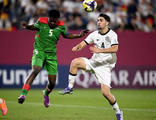 Football, Junior U 17 World Cup 2025 Doha Qatar Round of 16 15 11 2025 Match 83 Germany Burkina Faso Fadil Barro left, Burkina Faso against Elias Vali Fard right, Germany