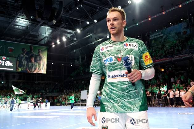 DEU, DHB, 1 HBL, Fuechse Berlin vs THW Kiel, 15 11 2025, Max Schmeling Halle, Berlin, DEU, DHB, 1 HBL, Fuechse Berlin vs THW Kiel, in the picture Mathias Gidsel Fuechse Berlin 19 , with microphone nordphotoxGmbHx xEngler nph00076