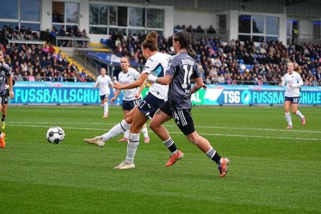Marie Steiner 19 TSG Hoffenheim Women with the ball in the penalty area while Geraldine Reuteler 14 Eintracht Frankfurt defends and Valesca Ampoorter 18 TSG Hoffenheim Women supports DFB Cup Women TSG Hoffenheim against Eintracht Frankfurt, at Dietmar Hopp Stadium in Hoffenheim Ball action in the penalty area Copyright: xspeedshotx