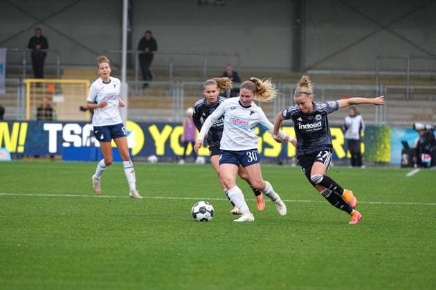 Franziska Harsch 17 TSG Hoffenheim Women with ball, while Jarne Teulings 9 Eintracht Frankfurt and Nadine Bitzer 30 TSG Hoffenheim Women defend, Pia Sophie Wolter 17 Eintracht Frankfurt in duel DFB Cup Women TSG Hoffenheim vs Eintracht Frankfurt, at Dietmar Hopp Stadium in Hoffenheim players in duel for ball Copyright: xspeedshotx