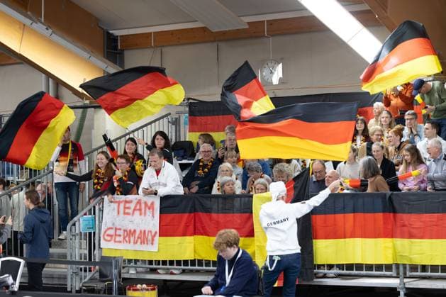 Billie Jean King Cup 2025 Play Offs, TC Ismaning, Munich, Germany, Team Germany, German fans waving flags on the tribune Tennis Billie Jean King Cup 2025 ITF Billie Jean King Cup TC Ismaning Ismaning Bavaria Germany November 16, 2025 Copyright: xJuergenxHasenkopfx