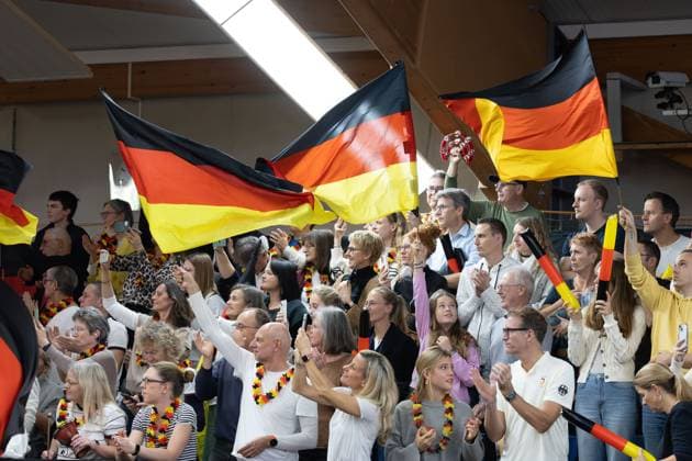 Billie Jean King Cup 2025 Play Offs, TC Ismaning, Munich, Germany, Team Germany, German fans waving flags on the tribune Tennis Billie Jean King Cup 2025 ITF Billie Jean King Cup TC Ismaning Ismaning Bavaria Germany November 16, 2025 Copyright: xJuergenxHasenkopfx