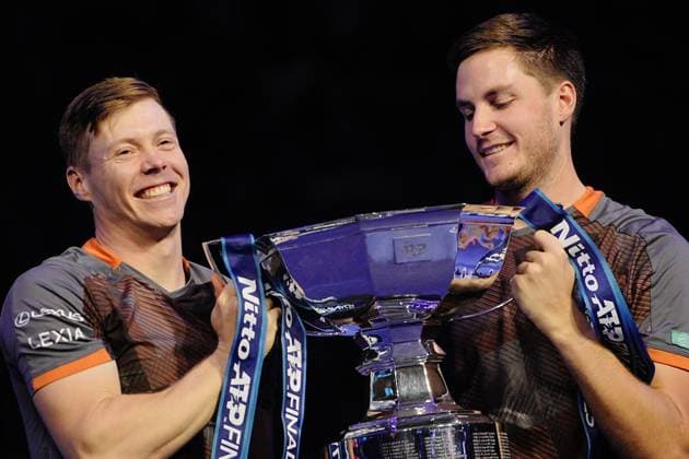Great Britain s Henry Patten and Finland™s Harri Heliovaara celebrate with the trophy after winning their doubles final match and the ATP, Tennis Herren Finals against Great Britain s Joe Salisbury and Neal Skupski at the Inalpi Arena in Turin, Italy - Sunday, Nov. 16, 2025. -  Copyright: xMarcoxAlpozzi LaPressex