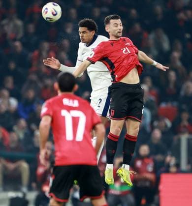 Jarell Quansah of England and Arber Hoxha of Albania. Albania v England, FIFA 2026 World Cup Qualifying, Group K, Football, Arena Kombetare, Tirana, Albania - 16 Nov 2025Tirana Arena Kombetare Albania EDITORIAL USE ONLY No use with unauthorised audio, video, data, fixture lists, club league logos or live services. Online in-match use limited to 120 images, no video emulation. No use in betting, games or single club league player publications. Copyright: xNikolaxKrstic Shutterstockx 15786244t
