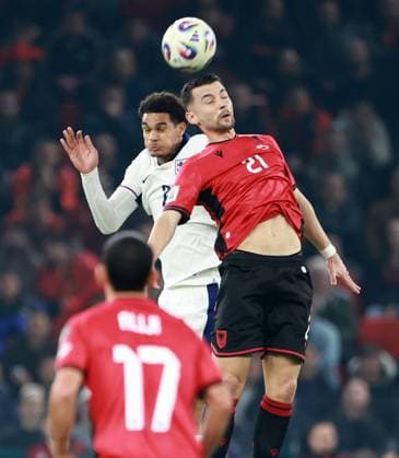 Jarell Quansah of England and Arber Hoxha of Albania. Albania v England, FIFA 2026 World Cup Qualifying, Group K, Football, Arena Kombetare, Tirana, Albania - 16 Nov 2025Tirana Arena Kombetare Albania EDITORIAL USE ONLY No use with unauthorised audio, video, data, fixture lists, club league logos or live services. Online in-match use limited to 120 images, no video emulation. No use in betting, games or single club league player publications. Copyright: xNikolaxKrstic Shutterstockx 15786244u