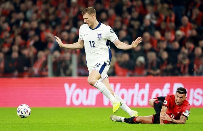 Dan Burn of England and Myrto Uzuni of Albania. Albania v England, FIFA 2026 World Cup Qualifying, Group K, Football, Arena Kombetare, Tirana, Albania - 16 Nov 2025Tirana Arena Kombetare Albania EDITORIAL USE ONLY No use with unauthorised audio, video, data, fixture lists, club league logos or live services. Online in-match use limited to 120 images, no video emulation. No use in betting, games or single club league player publications. Copyright: xNikolaxKrstic Shutterstockx 15786244ad