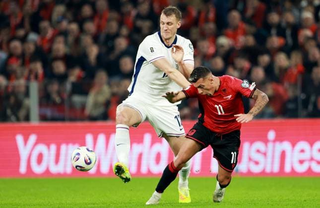 Dan Burn of England and Myrto Uzuni of Albania. Albania v England, FIFA 2026 World Cup Qualifying, Group K, Football, Arena Kombetare, Tirana, Albania - 16 Nov 2025Tirana Arena Kombetare Albania EDITORIAL USE ONLY No use with unauthorised audio, video, data, fixture lists, club league logos or live services. Online in-match use limited to 120 images, no video emulation. No use in betting, games or single club league player publications. Copyright: xNikolaxKrstic Shutterstockx 15786244z
