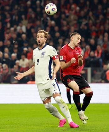 Harry Kane of England and Ardian Ismajli of Albania. Albania v England, FIFA 2026 World Cup Qualifying, Group K, Football, Arena Kombetare, Tirana, Albania - 16 Nov 2025Tirana Arena Kombetare Albania EDITORIAL USE ONLY No use with unauthorised audio, video, data, fixture lists, club league logos or live services. Online in-match use limited to 120 images, no video emulation. No use in betting, games or single club league player publications. Copyright: xNikolaxKrstic Shutterstockx 15786244ax