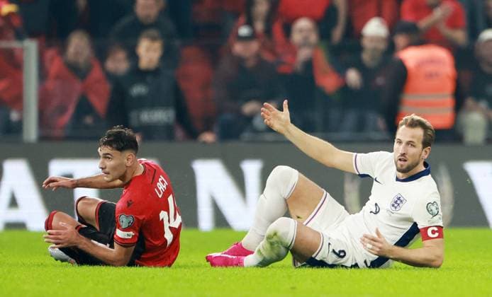 Qazim Laci of Albania and Harry Kane of England. Albania v England, FIFA 2026 World Cup Qualifying, Group K, Football, Arena Kombetare, Tirana, Albania - 16 Nov 2025Tirana Arena Kombetare Albania EDITORIAL USE ONLY No use with unauthorised audio, video, data, fixture lists, club league logos or live services. Online in-match use limited to 120 images, no video emulation. No use in betting, games or single club league player publications. Copyright: xNikolaxKrstic Shutterstockx 15786244as