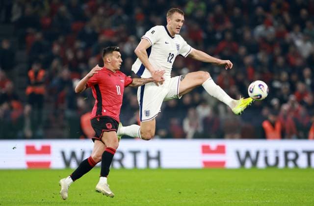 Myrto Uzuni of Albania and Dan Burn of England. Albania v England, FIFA 2026 World Cup Qualifying, Group K, Football, Arena Kombetare, Tirana, Albania - 16 Nov 2025Tirana Arena Kombetare Albania EDITORIAL USE ONLY No use with unauthorised audio, video, data, fixture lists, club league logos or live services. Online in-match use limited to 120 images, no video emulation. No use in betting, games or single club league player publications. Copyright: xNikolaxKrstic Shutterstockx 15786244br