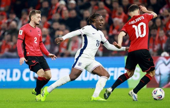 Eberechi Eze of England and Nedim Bajrami of Albania. Albania v England, FIFA 2026 World Cup Qualifying, Group K, Football, Arena Kombetare, Tirana, Albania - 16 Nov 2025Tirana Arena Kombetare Albania EDITORIAL USE ONLY No use with unauthorised audio, video, data, fixture lists, club league logos or live services. Online in-match use limited to 120 images, no video emulation. No use in betting, games or single club league player publications. Copyright: xNikolaxKrstic Shutterstockx 15786244bw