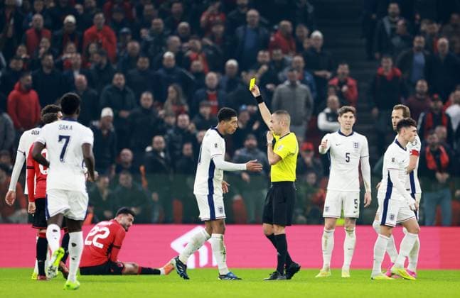 Jude Bellingham of England is shown a yellow card. Albania v England, FIFA 2026 World Cup Qualifying, Group K, Football, Arena Kombetare, Tirana, Albania - 16 Nov 2025Tirana Arena Kombetare Albania EDITORIAL USE ONLY No use with unauthorised audio, video, data, fixture lists, club league logos or live services. Online in-match use limited to 120 images, no video emulation. No use in betting, games or single club league player publications. Copyright: xNikolaxKrstic Shutterstockx 15786244cq