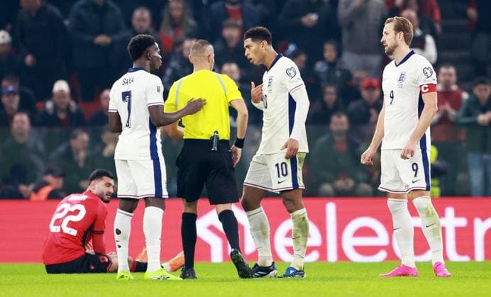 Jude Bellingham of England is shown a yellow card. Albania v England, FIFA 2026 World Cup Qualifying, Group K, Football, Arena Kombetare, Tirana, Albania - 16 Nov 2025Tirana Arena Kombetare Albania EDITORIAL USE ONLY No use with unauthorised audio, video, data, fixture lists, club league logos or live services. Online in-match use limited to 120 images, no video emulation. No use in betting, games or single club league player publications. Copyright: xNikolaxKrstic Shutterstockx 15786244cv