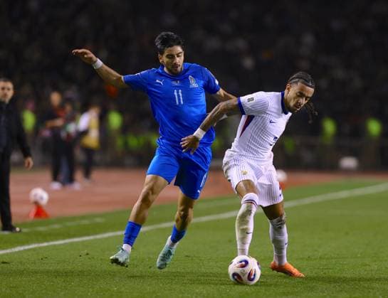 Azerbaijan v France - FIFA World Cup, WM, Weltmeisterschaft, Fussball European Qualifiers BAKU, AZERBAIJAN - NOVEMBER 16: Xeyal Aliyev (11) of Azerbaijan in action against Malo Gusto of France during the 2026 FIFA World Cup European Qualifiers match between Azerbaijan and France on November 16, 2025 in Baku, Azerbaijan. Resul Rehimov Anadolu Baku Azerbaijan. Editorial use only. Please get in touch for any other usage.  Copyright: x2025xAnadoluxResulxRehimovx