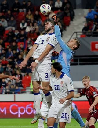 Serbia vs Latvia, Group K World Cup 2026 European Qualifiers Leskovac, Serbia. 16th Nov, 2025. Serbia s Strahinja Pavlovic vies with Latvia s goalkeeper Krisjanis Zviedris during the Group K World Cup 2026 European Qualifiers football match between Serbia and Latvia on November 16. 2025. in Leskovac, Serbia. Leskovac Serbia Copyright: xPedjaxMilosavljevic STARSPORTx