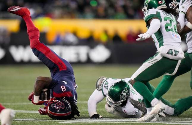November 17, 2025, Winnipeg, Mb, CANADA: Montreal Alouettes Stevie Scott III (8) is upended by Saskatchewan Roughriders Micah Johnson (4) during first half CFL football action at the 112th Grey Cup, in Winnipeg on Sunday, Nov. 16, 2025. Canada News - November 17, 2025  - ZUMAc35_ 20251117_zaf_c35_022 Copyright: xDarrylxDyckx