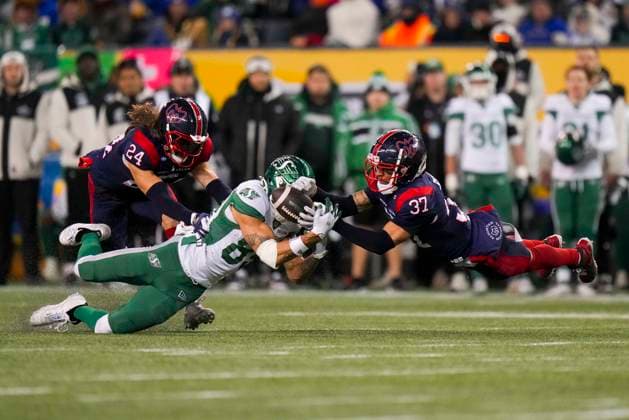 November 17, 2025, Winnipeg, Mb, CANADA: Saskatchewan Roughriders Kian Schaffer-Baker (89) is tackled by Montreal Alouettes Marc-Antoine Dequoy (24) as Montreal Alouettes Wesley Sutton (37) reaches for the ball during second half CFL football action at the 112th Grey Cup, in Winnipeg on Sunday, Nov. 16, 2025. Canada News - November 17, 2025  - ZUMAc35_ 20251117_zaf_c35_029 Copyright: xDarrylxDyckx