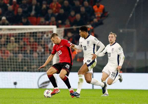 Group K European qualification football match between Albania and England in Tirana, Albania. - 15 November 2025. Albania s Ylber Ramadani (L) fights for the ball with England s Jude Bellingham (C) during the FIFA World Cup, WM, Weltmeisterschaft, Fussball 2026 European qualification football match between Albania and England at the Air Albania stadium in Tirana, on November 16, 2025. TIRANA ALBANIA Copyright: xMALTONxDIBRAx