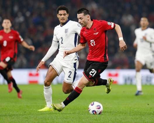 Group K European qualification football match between Albania and England in Tirana, Albania. - 15 November 2025. Albania s Arber Hoxha (R) fights for the ball with England s Jarell Quansah (L) during the FIFA World Cup, WM, Weltmeisterschaft, Fussball 2026 European qualification football match between Albania and England at the Air Albania stadium in Tirana, on November 16, 2025. TIRANA ALBANIA Copyright: xMALTONxDIBRAx