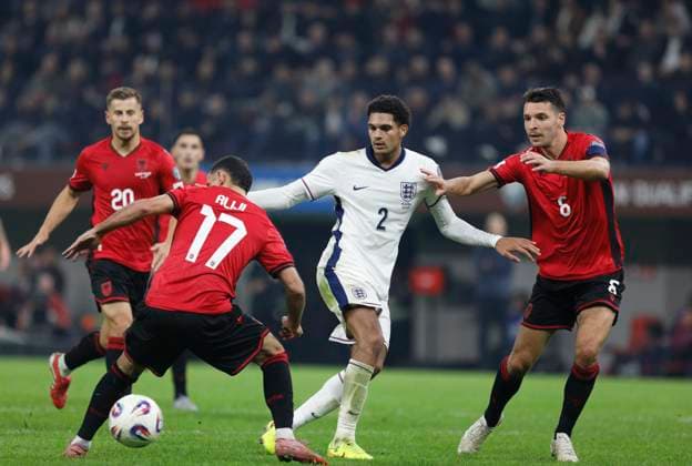 Group K European qualification football match between Albania and England in Tirana, Albania. - 15 November 2025. Albania s Naser Aliji (L) and Berat Djimsiti (R) fights for the ball with England s Jarell Quansah (C) during the FIFA World Cup, WM, Weltmeisterschaft, Fussball 2026 European qualification football match between Albania and England at the Air Albania stadium in Tirana, on November 16, 2025. TIRANA ALBANIA Copyright: xMALTONxDIBRAx