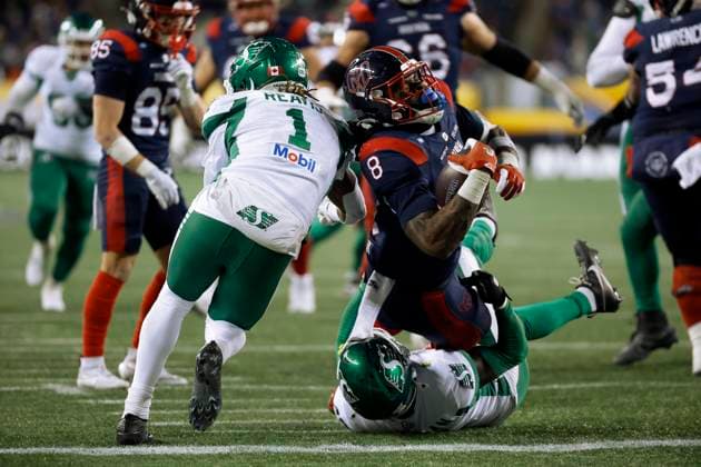 November 16, 2025, Winnipeg, Mb, CANADA: Montreal Alouettes Stevie Scott III (8) makes the touchdown over Saskatchewan Roughriders Rolan Milligan (0) during second half CFL football action at the 112th Grey Cup, in Winnipeg on Sunday, Nov. 16, 2025. Canada News - November 16, 2025  - ZUMAc35_ 20251116_zaf_c35_150 Copyright: xJohnxWoodsx