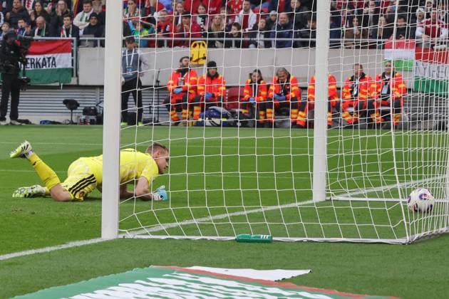(251117) -- BUDAPEST, Nov. 17, 2025 -- Denes Dibusz, goalkeeper of Hungary, fails to save a goal from Troy Parrott (not pictured) of Ireland during the FIFA World Cup, WM, Weltmeisterschaft, Fussball 2026 European qualifiers football match between Hungary and Ireland in Budapest, Hungary, on Nov. 16, 2025. (Photo by Xinhua) (SP)HUNGARY-BUDAPEST-FOOTBALL-2026 WORLD CUP EUROPEAN QUALIFIERS-HUNGARY VS IRELAND AttilaxVolgyi