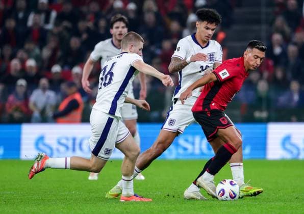 November 16, 2025, Tirana, Tirana, Albania: Myrto Ozuni of Albania and Nico O Reilly and Adam Wharton of England fight for the ball during their FIFA World Cup, WM, Weltmeisterschaft, Fussball 2026 qualifier match between Albania and England in Tirana, Albania on 16 November 2025. Tirana Albania - ZUMAb266 20251116_zip_b266_002 Copyright: xArmandoxBabanix