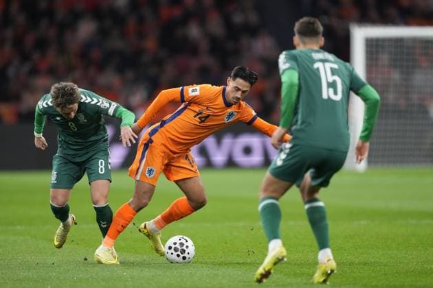 AMSTERDAM, 17-11-2025, Johan Cruijff ArenA , season 2025 2026 , FIFA World Cup, WM, Weltmeisterschaft, Fussball Qualifier football , match between The Netherlands and Lithuania. Pictures shows Lithuania player Tomas Kalinauskas, Netherlands player Tijjani Reijnders Netherlands - Lithuania  x32075469x Copyright: