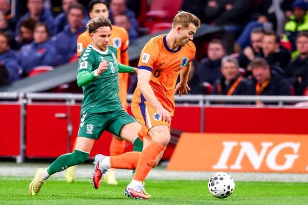 2025-11-17 Netherlands v Lithuania - UEFA World Cup Qualification match AMSTERDAM, GERMANY - NOVEMBER 17: Matthijs de Ligt of Netherlands is challenged by Tomas Kalinauskas of Lithuania during the UEFA World Cup Qualification match match between Netherlands and Lithuania at Johan Cruijff ArenA on November 17, 2025 in Amsterdam, Germany. Amsterdam Johan Cruijff ArenA Germany Content not available for redistribution in The Netherlands directly or indirectly through any third parties. Copyright: xPieterxvanxderxWoudex