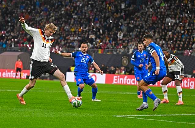 17 11 2025, Football World Cup Qualification Europe 2025 26, Matchday 10, Germany Slovakia, at Red Bull Arena Leipzig Germany f l Nick Woltemade Germany v Stanislav Lobotka Slovakia , Matus Bero Slovakia , Adam Obert Slovakia and Serge Gnabry Germany