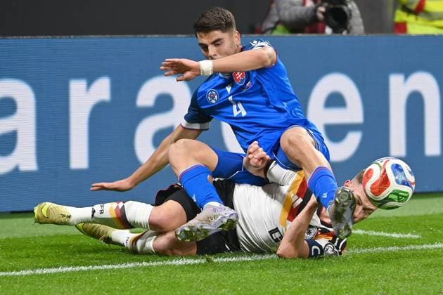 Joshua KIMMICH GER , action,duel against Adam OBERT SVK Soccer international, World Cup Qualification Group A Matchday 06, Germany GER Slovakia SVK on 17 11 2025, RED BULL ARENA