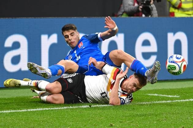 Joshua KIMMICH GER , action,duel against Adam OBERT SVK Soccer international, World Cup Qualification Group A Matchday 06, Germany GER Slovakia SVK on 17 11 2025, RED BULL ARENA Â
