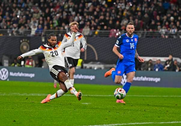 17 11 2025, Football World Cup Qualification Europe 2025 26, Matchday 10, Germany Slovakia, at Red Bull Arena Leipzig Germany Serge Gnabry Germany scores to make it 2 0 against Towart Martin Dubravka Slovakia