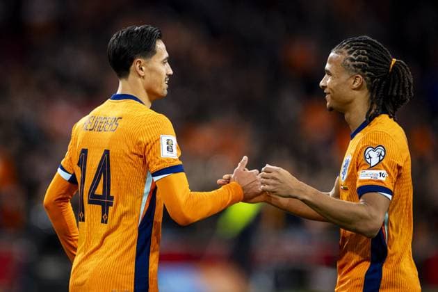 AMSTERDAM (l-r) Tijjani Reijnders of the Netherlands and Nathan Ake of the Netherlands celebrate the 1-0 goal during the World Cup qualifying match between the Netherlands and Lithuania at the Johan Cruijff ArenA on November 17, 2025, in Amsterdam, Netherlands. ANP KOEN VAN WEEL FIFA 2026 World Cup Qualifier 2025-2026 xVIxANPxSportx xxANPxIVx 542368416 originalFilename: 542368416.jpg