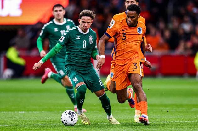2025-11-17 Netherlands v Lithuania - UEFA World Cup Qualification match AMSTERDAM, NETHERLANDS - NOVEMBER 17: Tomas Kalinauskas of Lithuania, Jurrien Timber of Netherlands battle for the ball during the UEFA World Cup Qualification match match between Netherlands and Lithuania at Johan Cruijff ArenA on November 17, 2025 in Amsterdam, Netherlands. Amsterdam Johan Cruijff ArenA Netherlands Content not available for redistribution in The Netherlands directly or indirectly through any third parties. Copyright: xPieterxvanxderxWoudex